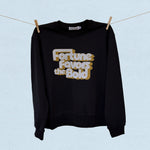 Black sweatshirt with 'Fortune Favors the Bold' text on a light blue background